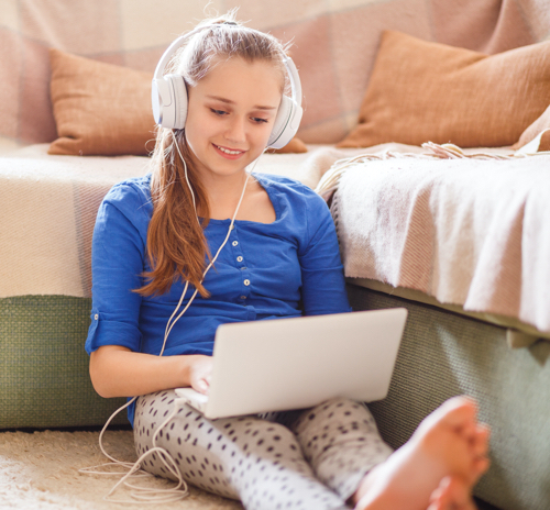 Child listening to headphones